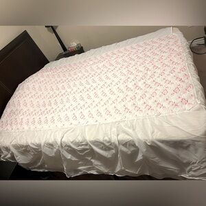 Vintage 1970s white twin bedspread with pink embroidery